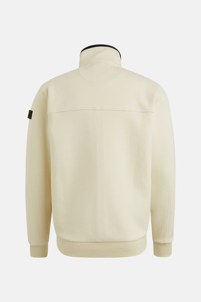 Gilet beige de PME Legend, avec un col montant noir et un patch logo sur la manche.