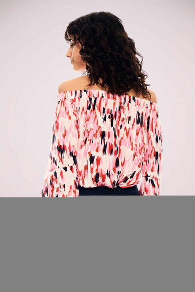 Off-the-shoulder blouse with pink, black, and cream abstract print, shown from back view on model with curly hair