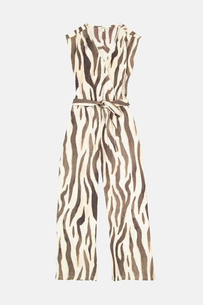Combinaison motif zèbre marron et crème de GARCIA, sans manches, col cache-cœur orné de pompons blancs et ceinture nouée à la taille.