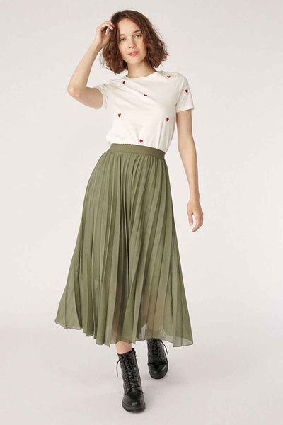 Olive green pleated 3/4 length skirt with elastic waist, worn with white heart-print tee and black combat boots, full front view