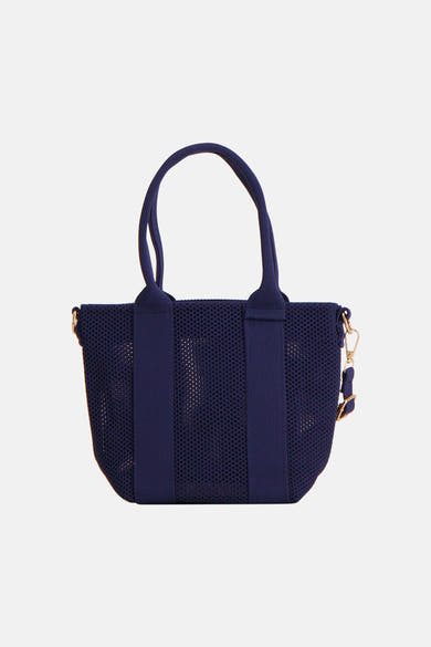 Access® marineblauwe mesh schoudertas met handvatten en gouden details.