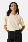 Ecru short-sleeve t-shirt with small orange "ITALIA AMORE" print on chest, worn with black jeans, front view