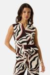 Multicolored sleeveless blouse with bold abstract print, front buttons, and textured fabric, worn with matching pants in a lifestyle front view