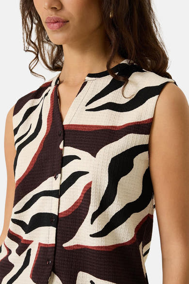 Multicolored sleeveless blouse with bold abstract pattern, textured fabric, front button closure, and V-neckline, shown in close-up front view.