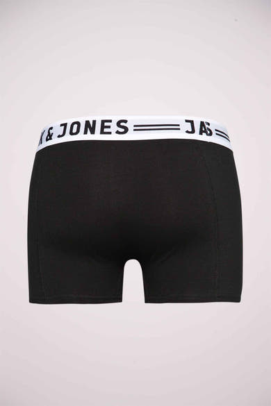 Boxer bleu de JACK & JONES, avec une ceinture élastique blanche portant le nom de la marque.