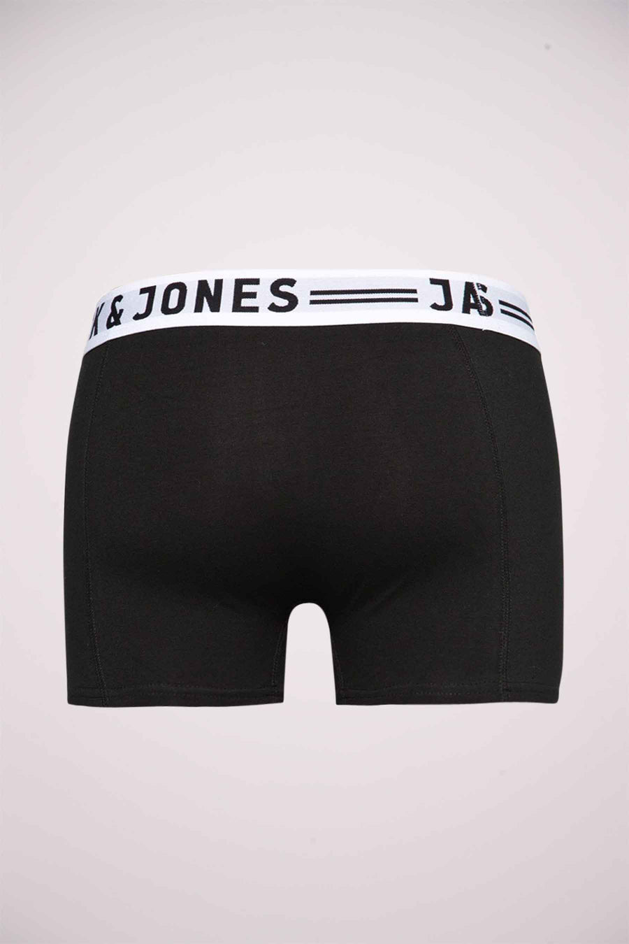 Boxer bleu de JACK & JONES, avec une ceinture élastique blanche portant le nom de la marque.