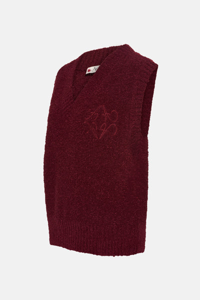 Débardeur bordeaux en maille bouclée de ADORE, avec un motif brodé ton sur ton sur le devant.
