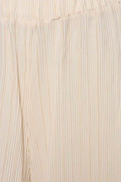 Beige geplooide broek van Zabaione, met een elastische tailleband en een gekreukte textuur.