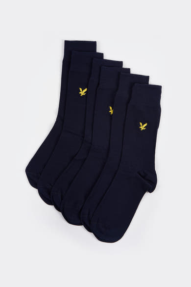 Marineblauwe sokken van LYLE & SCOTT, met gouden vogel-logo.