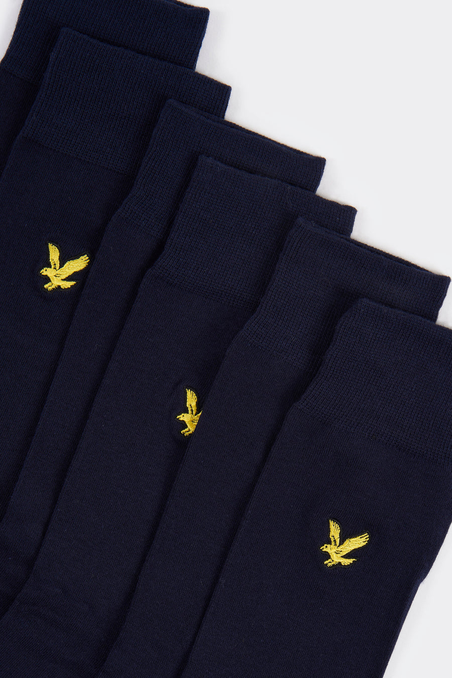 Chaussettes bleues de LYLE & SCOTT, avec logo brodé d'un aigle jaune sur le côté.
