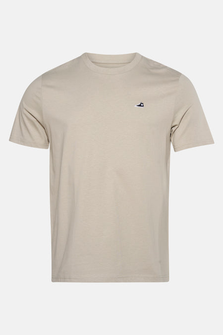 Beige T-shirt met korte mouwen van STROM, met een discreet schoenlogo.