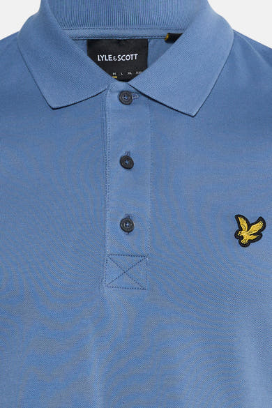 Blue short-sleeve polo shirt by Lyle & Scott, featuring ribbed collar, dark buttons, and embroidered golden eagle logo on chest.
