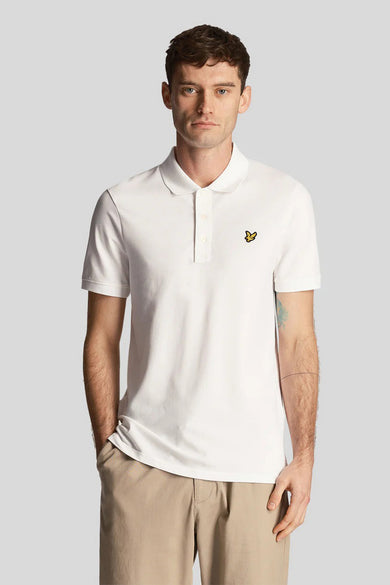 White short-sleeve polo shirt with classic collar and small yellow bird logo on chest, worn by model in front view.