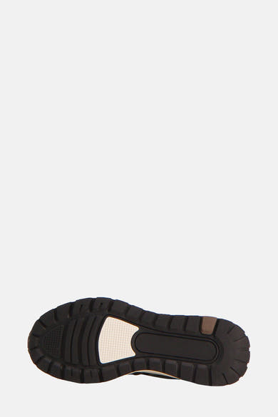 Wit-zwarte sneakerzool van LYLE & SCOTT, met textuurpatroon.