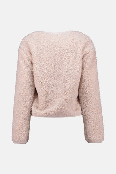 Veste courte écru de ZABAIONE, en texture pelucheuse sur fond neutre.