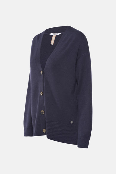 Blauwe tricotcardiganigan Zabaioneione met een knoppenknl en een klein decoratief detail aan de onderkant.