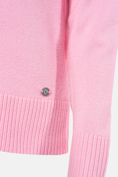 Ritsrokken roze Zabaione met een zachte textuur en een klein decoratief detail in de v van een hart.