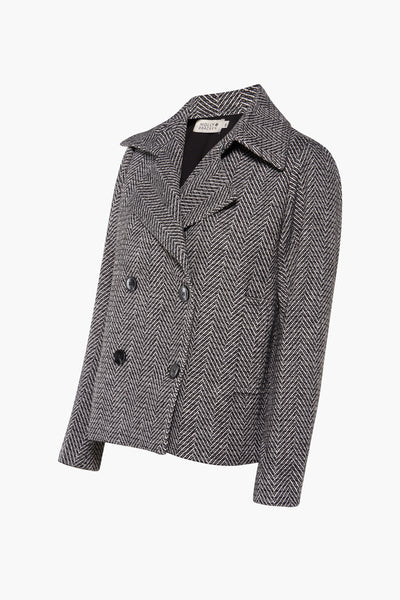 Veste courte noire à chevrons de Molly Bracken, avec double boutonnage et col tailleur.