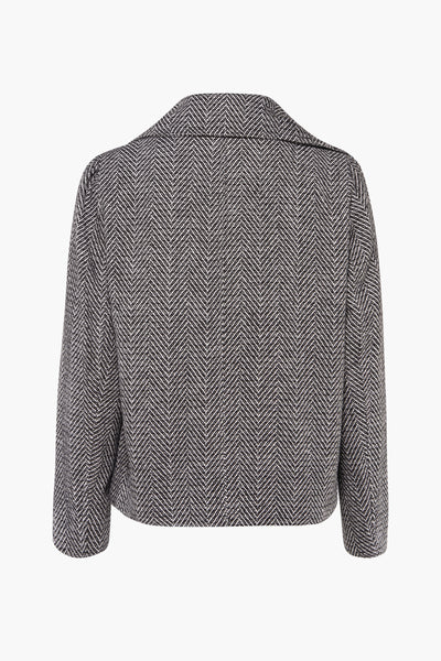 Veste courte noire by Molly Bracken avec motif à chevrons, coupe structurée et col classique.