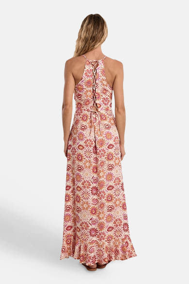 Robe longue multicolore par Molly Bracken, avec motif floral et dos lacé.
