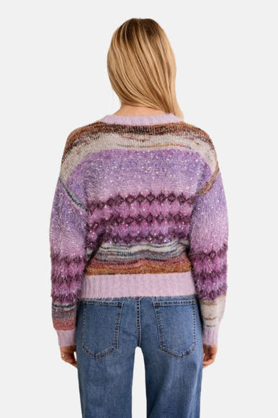 Multicolored O-neck sweater with textured knit and geometric patterns, back view, worn with blue jeans