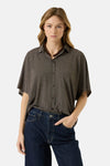Brown 3/4 sleeve blouse with button front and relaxed fit, worn with dark jeans and beaded necklace, front view