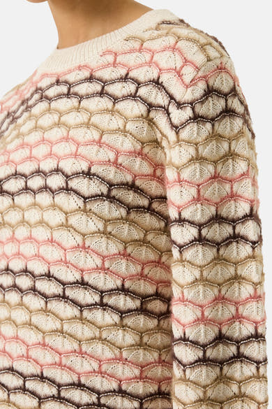 Ecru O-neck sweater with textured scalloped knit pattern in cream, pink, and brown tones, close-up side view