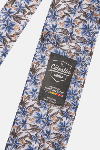 Multikleurige stropdas van MR. CELESTIN met een blauw, bruin en beige bloemenpatroon.