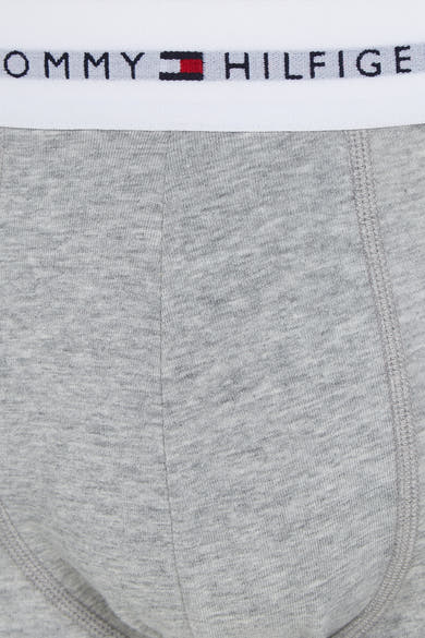 Boxer gris chiné de Tommy Jeans avec une ceinture élastique blanche logotypée.