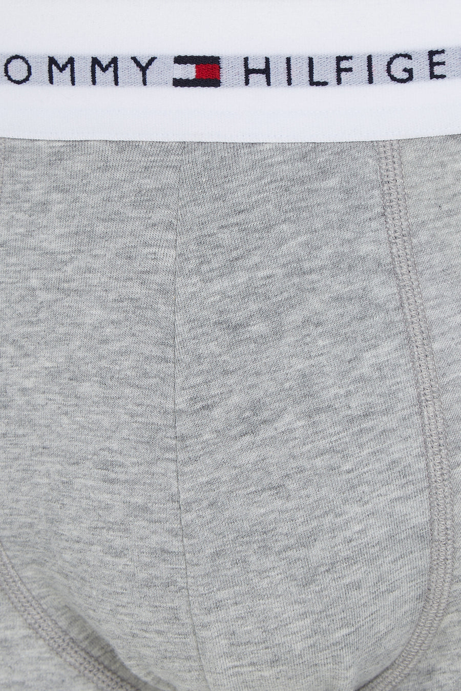 Boxer gris chiné de Tommy Jeans avec une ceinture élastique blanche logotypée.