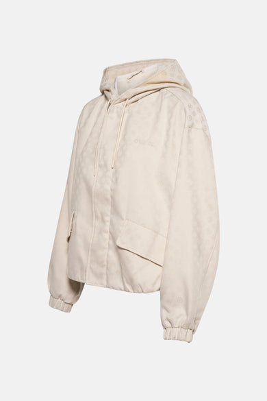 Veste courte écru de Guess avec capuche, motif ton sur ton et poche plaquée.