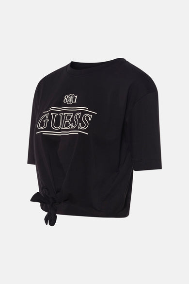 Zwart T-shirt met korte mouwen van Guess, met witte opdruk, aan de voorkant geknoopt.