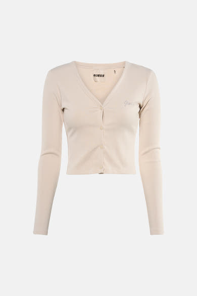 Ecru T-shirt met korte mouwen van Guess, gedragen met een vest en een wijde jeans.