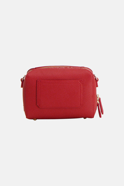 Sac à bandoulière rouge de VALENTINO BAGS, avec texture grainée et fermeture éclair dorée.