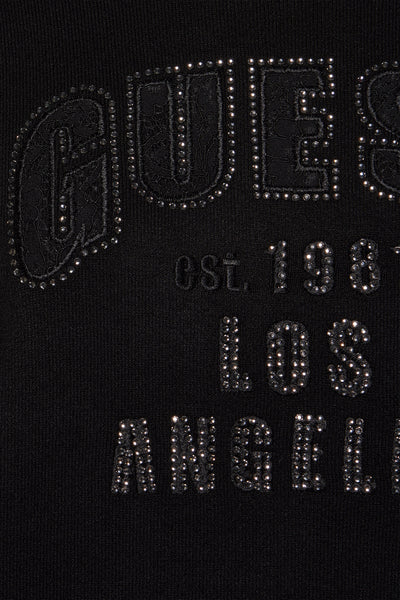 Pull noir à col rond de Guess orné de strass formant un lettrage et des chiffres.
