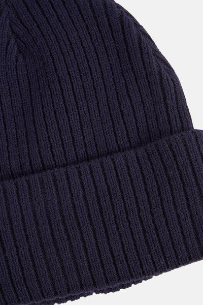 Bonnet bleu marine de DODI, en maille côtelée épaisse avec revers.
