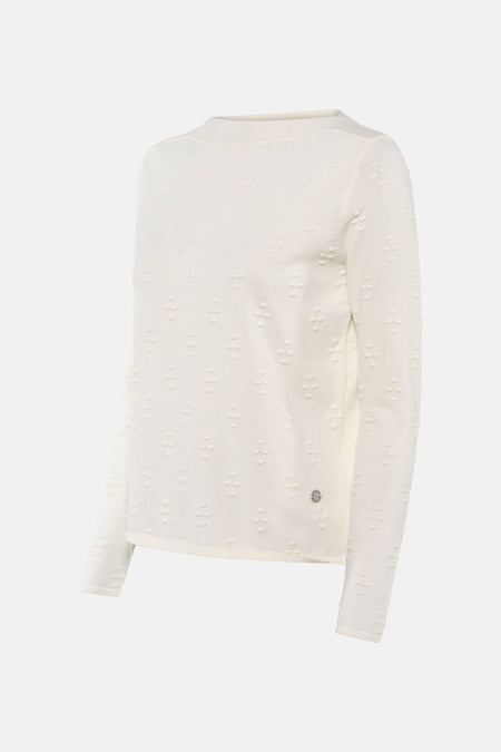 Pull écru à col rond de ZABAIONE, avec motif texturé en relief et logo discret sur le bas.