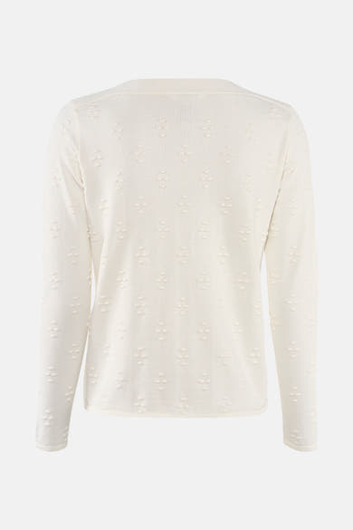 Pull à col rond écru de Zabaione avec motif en relief et manches longues.
