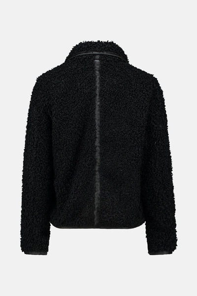 Veste courte noire en tissu bouclé de ZABAIONE, avec empiècement vertical en cuir au dos.