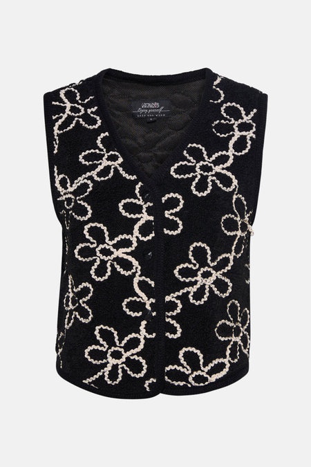 Zwarte Zabaione-gilet met crème geborduurd bloemenpatroon, knoopsluiting en bouclétextuur.
