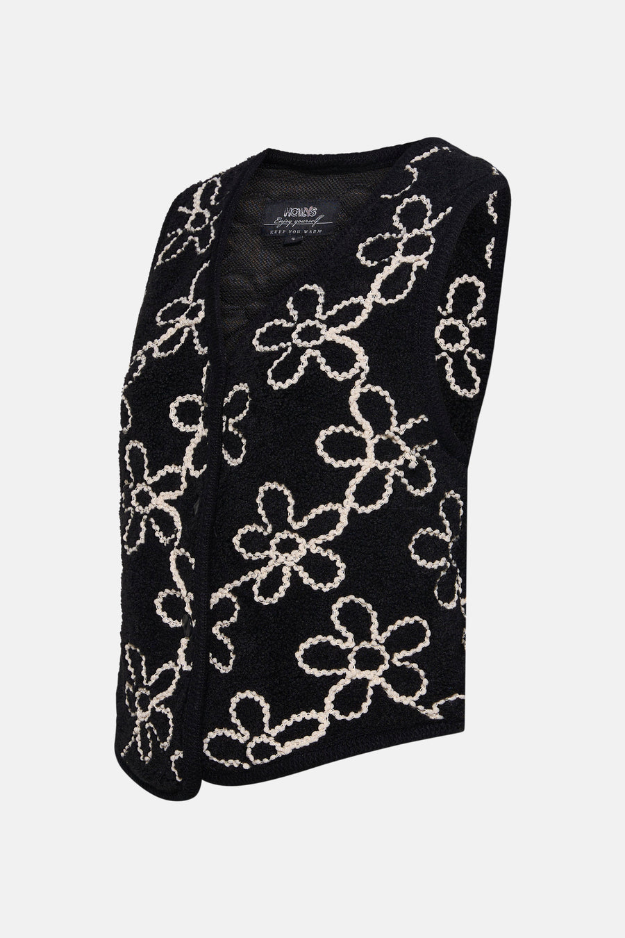 ZABAIONE zwart gilet met contrasterend geborduurd bloemenpatroon op een bouclé textuur.