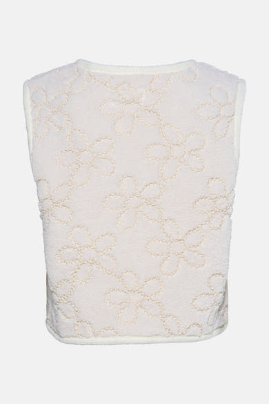 Ecru gilet van ZABAIONE met reliëf bloemenpatroon op een getextureerde stof.