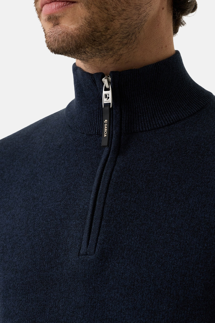 Navy blue ribbed knit half-zip turtleneck sweater by Garcia, featuring metallic zipper with branded pull tab, close-up front view