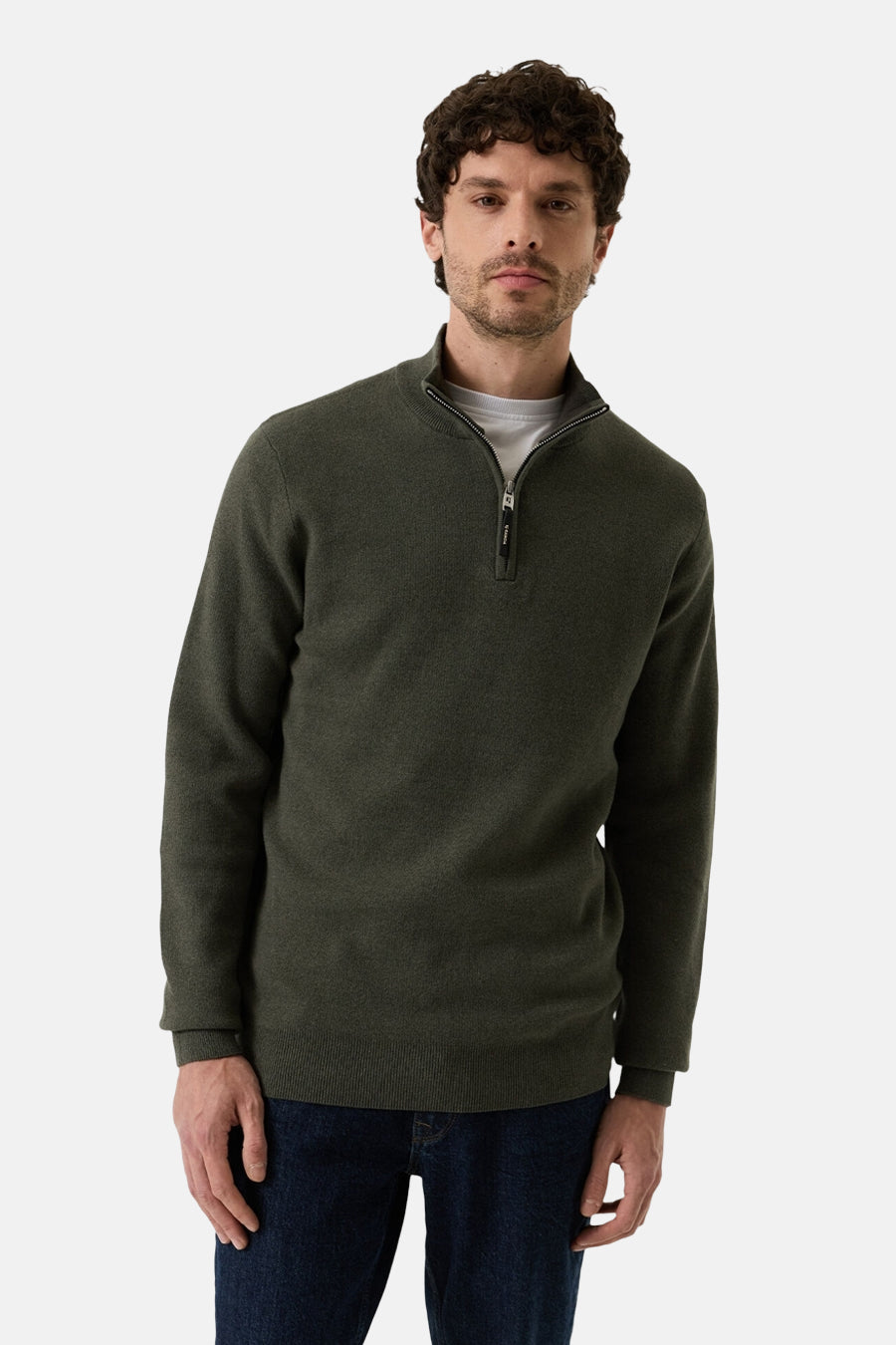 Olive green half-zip sweater with ribbed cuffs and hem, worn over a white crewneck, front view on model