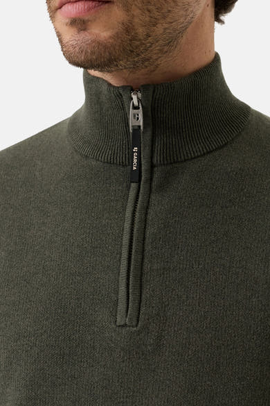 Olive ribbed knit half-zip turtleneck sweater by Garcia, close-up front view with visible zipper pull and textured fabric.