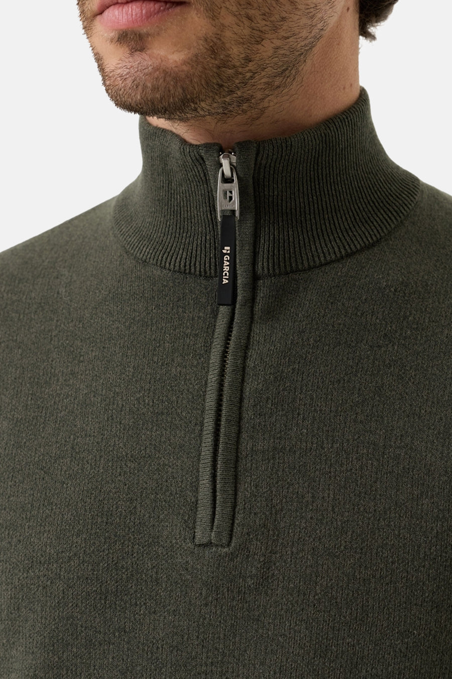 Olive ribbed knit half-zip turtleneck sweater by Garcia, close-up front view with visible zipper pull and textured fabric.