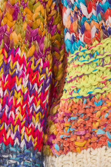Multikleurige ADORE-cardigan met een kleurrijk visgraatpatroon en een dikke gebreide textuur.